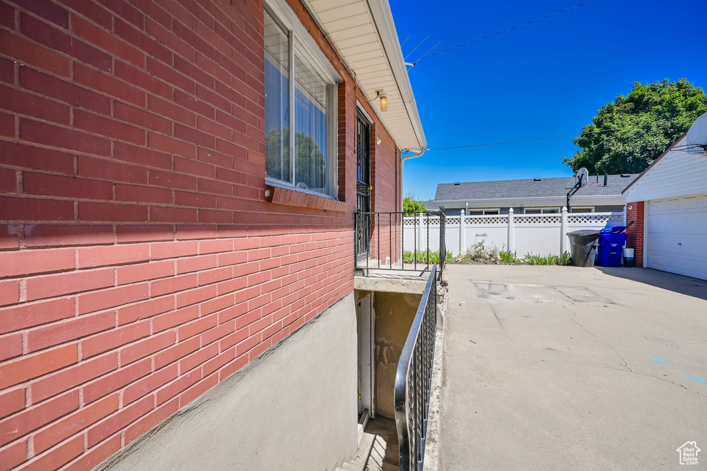 View of side of home featuring a garage