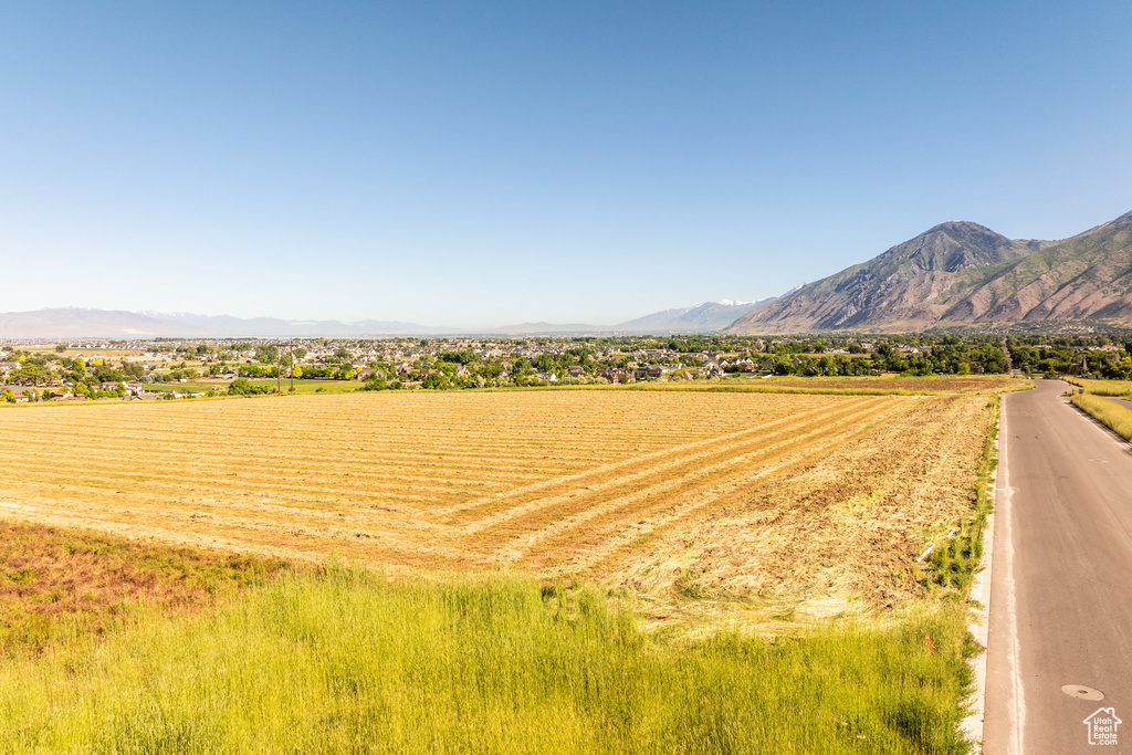 Property view of mountains with a rural view