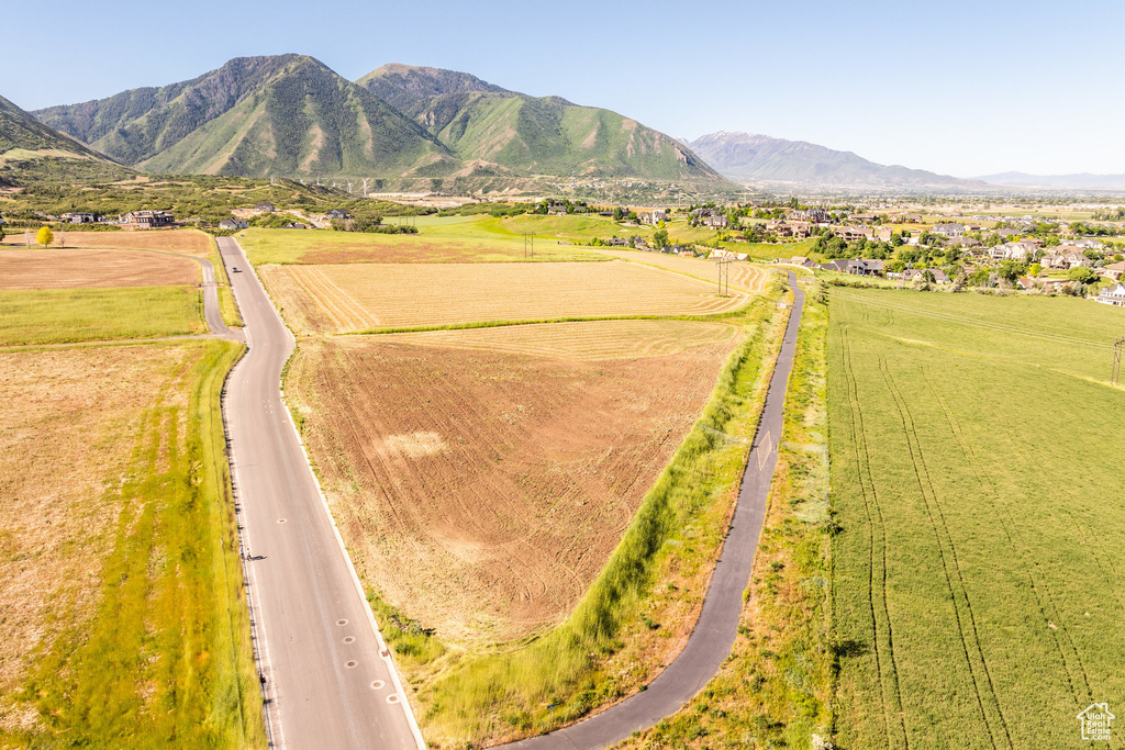 Birds eye view of property with a mountain view and a rural view