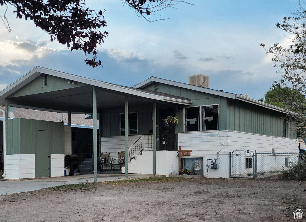 Manufactured / mobile home featuring a gate and a chimney