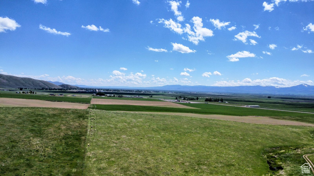 View of home's community featuring a mountain view and a yard