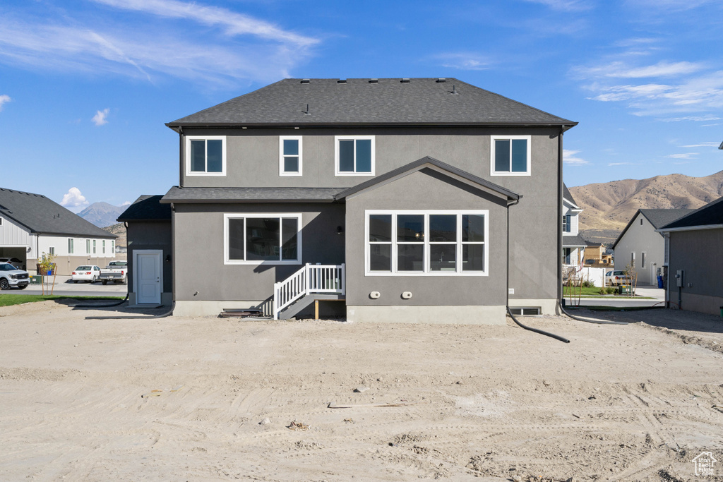 Back of house featuring a mountain view