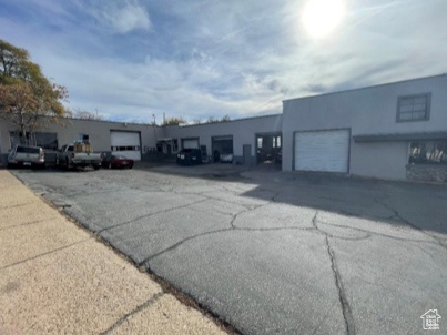 View of building exterior featuring a garage