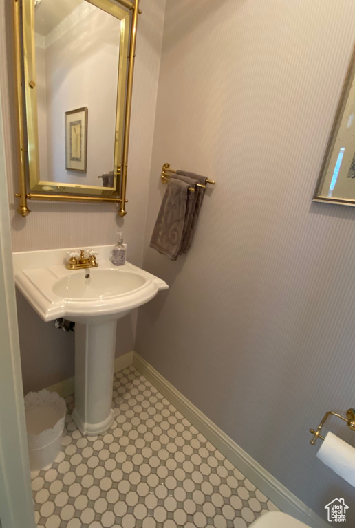 Bathroom featuring toilet and tile patterned floors