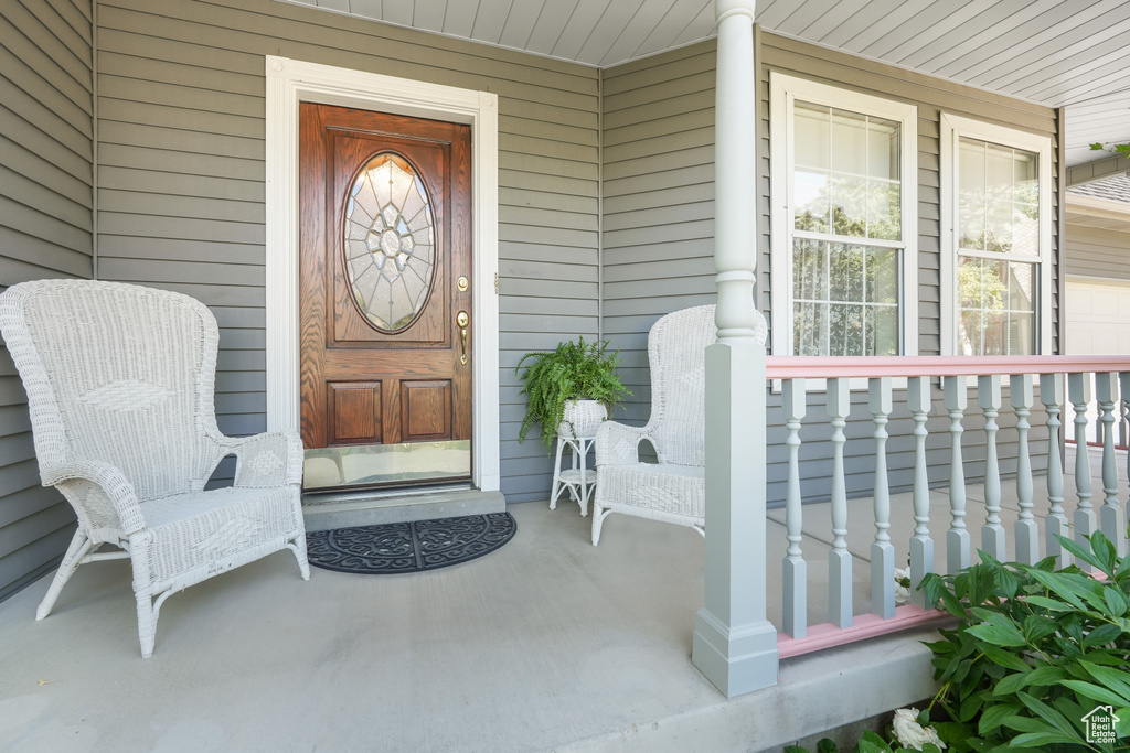 Doorway to property featuring a porch