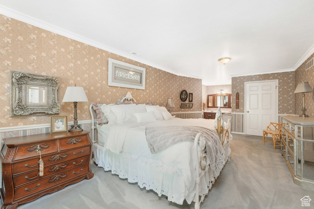 Bedroom with crown molding and carpet flooring