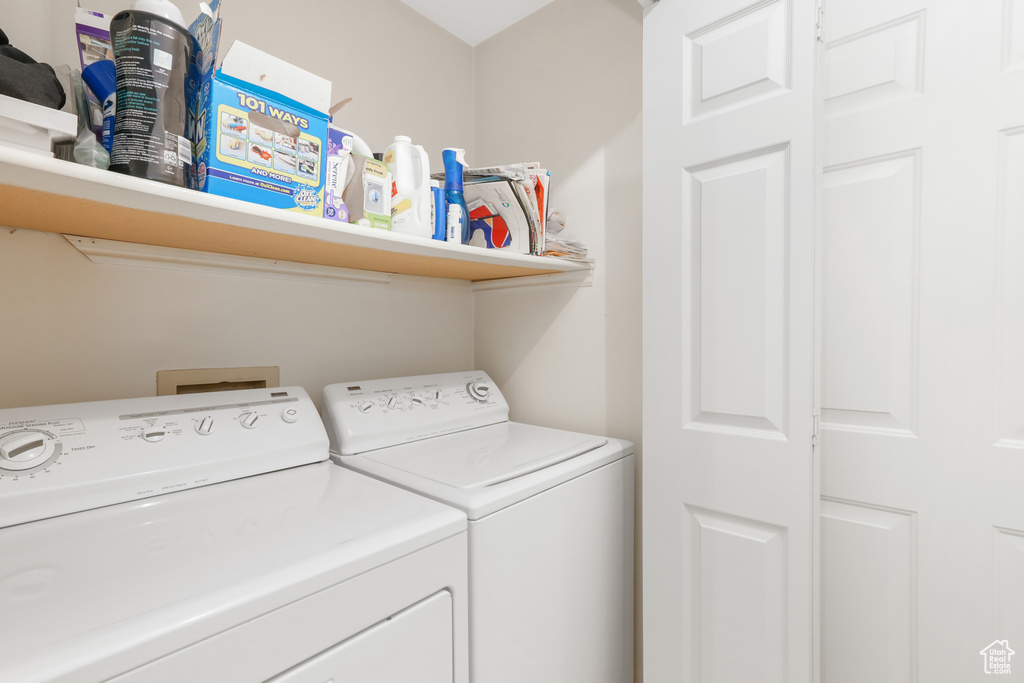 Washroom with washing machine and dryer and washer hookup