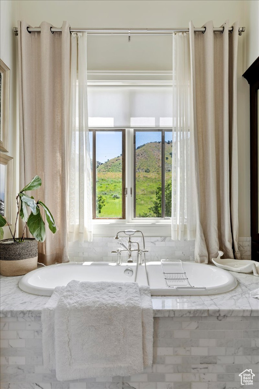 Bathroom with a relaxing tiled bath