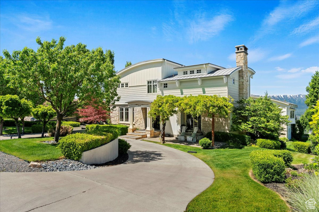 View of front of property with a front lawn