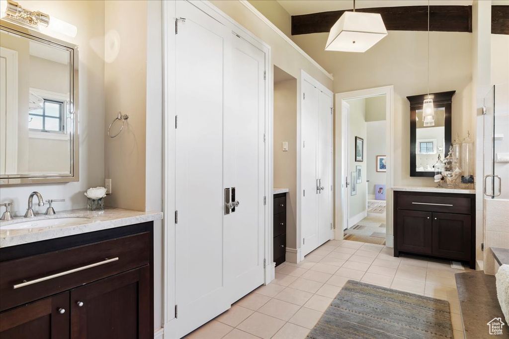 Bathroom featuring tile flooring and vanity