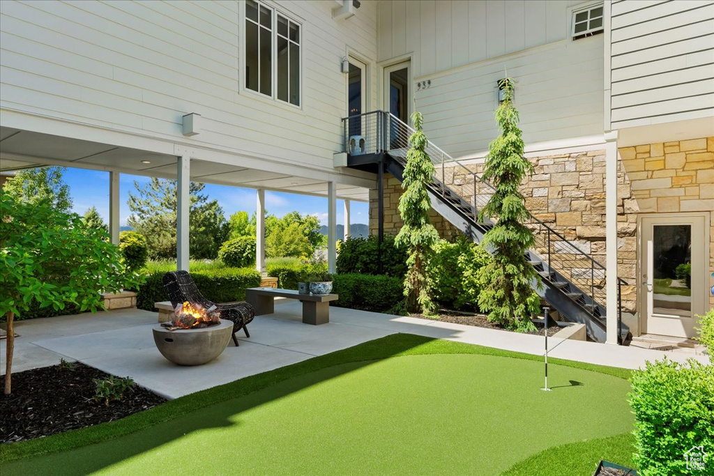 Exterior space featuring a patio area and a fire pit