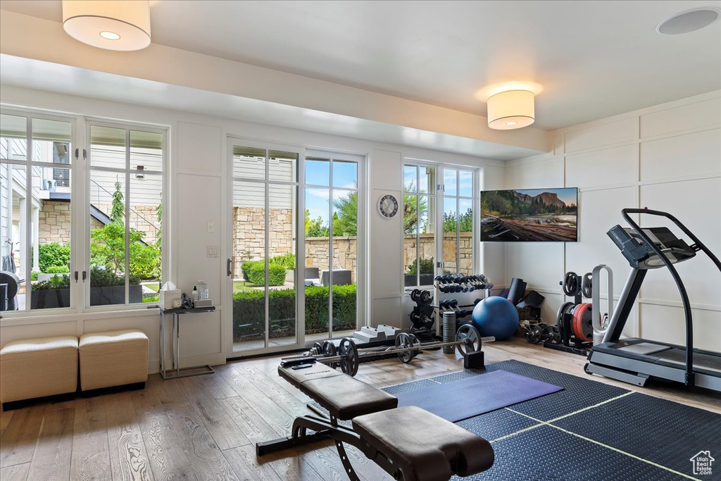 Exercise area with hardwood / wood-style flooring