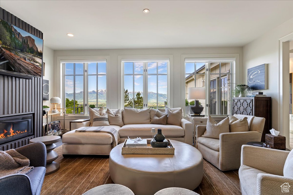 Living room with dark hardwood / wood-style floors