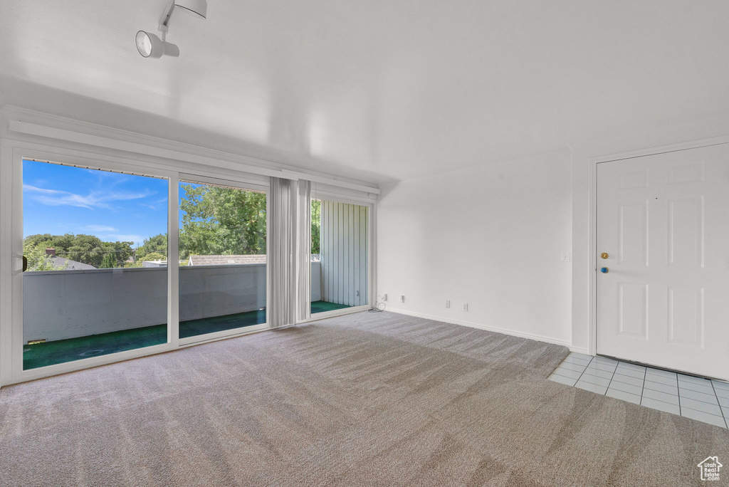 Spare room with tile flooring