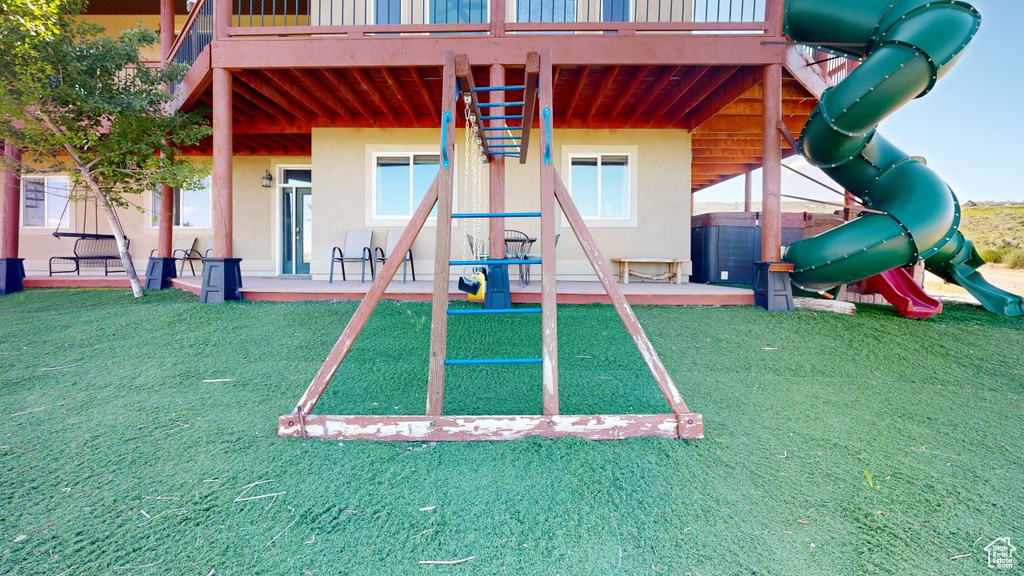 View of playground featuring a yard