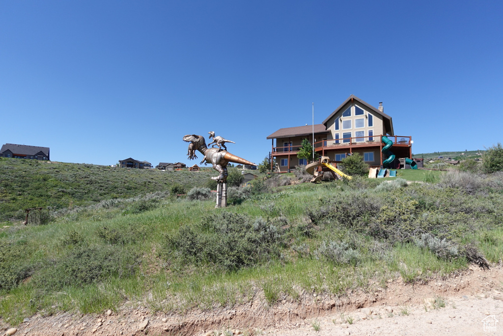 Back of house with a rural view