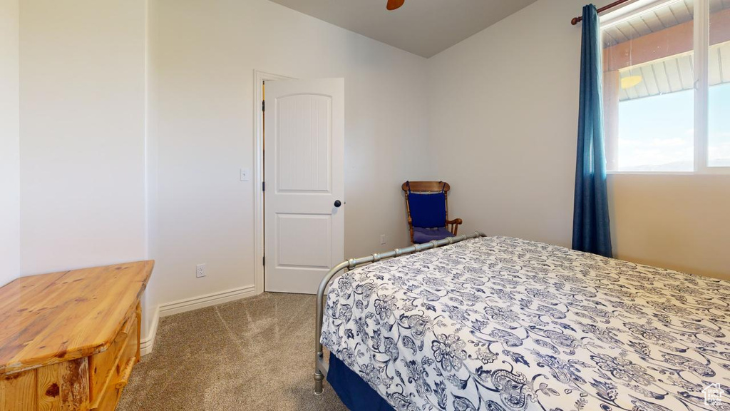 Bedroom featuring carpet and ceiling fan