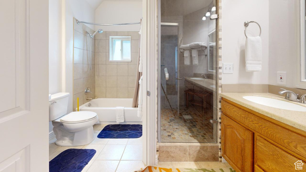 Bathroom with tile flooring, toilet, and oversized vanity