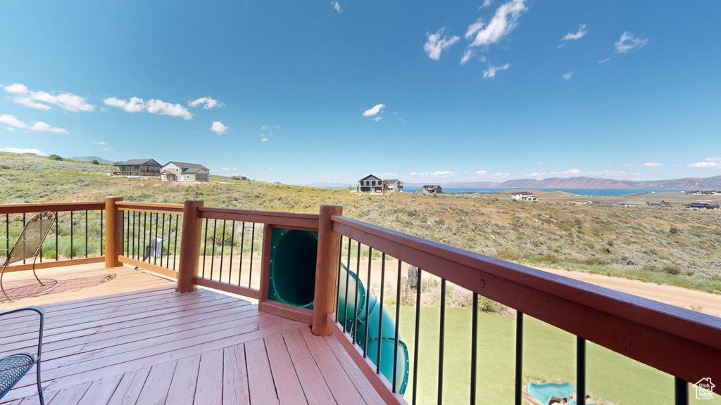 Wooden deck featuring a mountain view