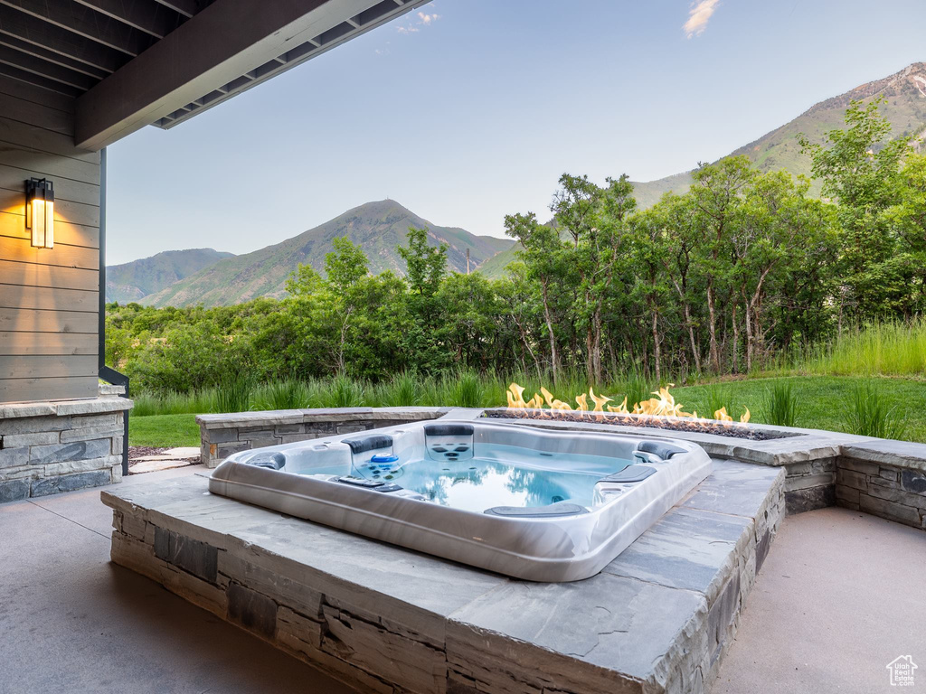 View of swimming pool with a mountain view