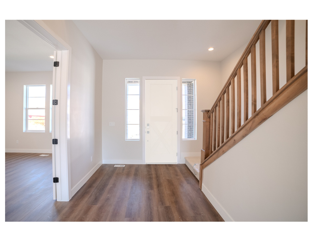 Entrance foyer with dark wood-type flooring