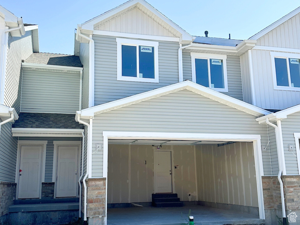 View of front of property featuring a garage