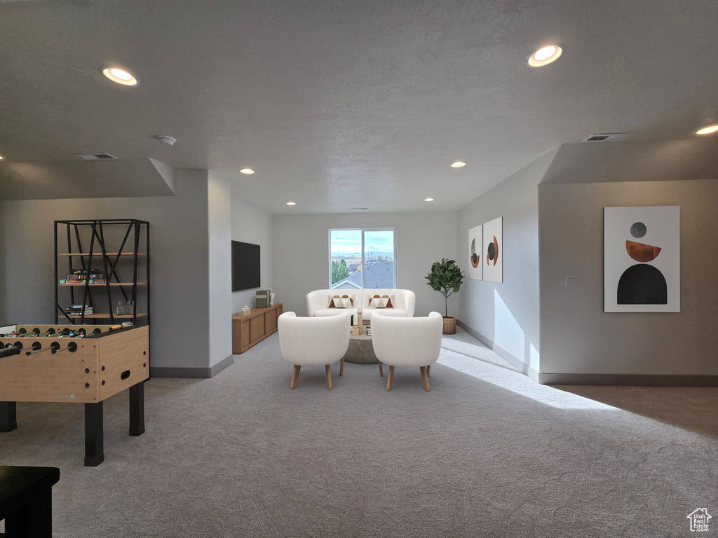 Interior space featuring a textured ceiling and carpet