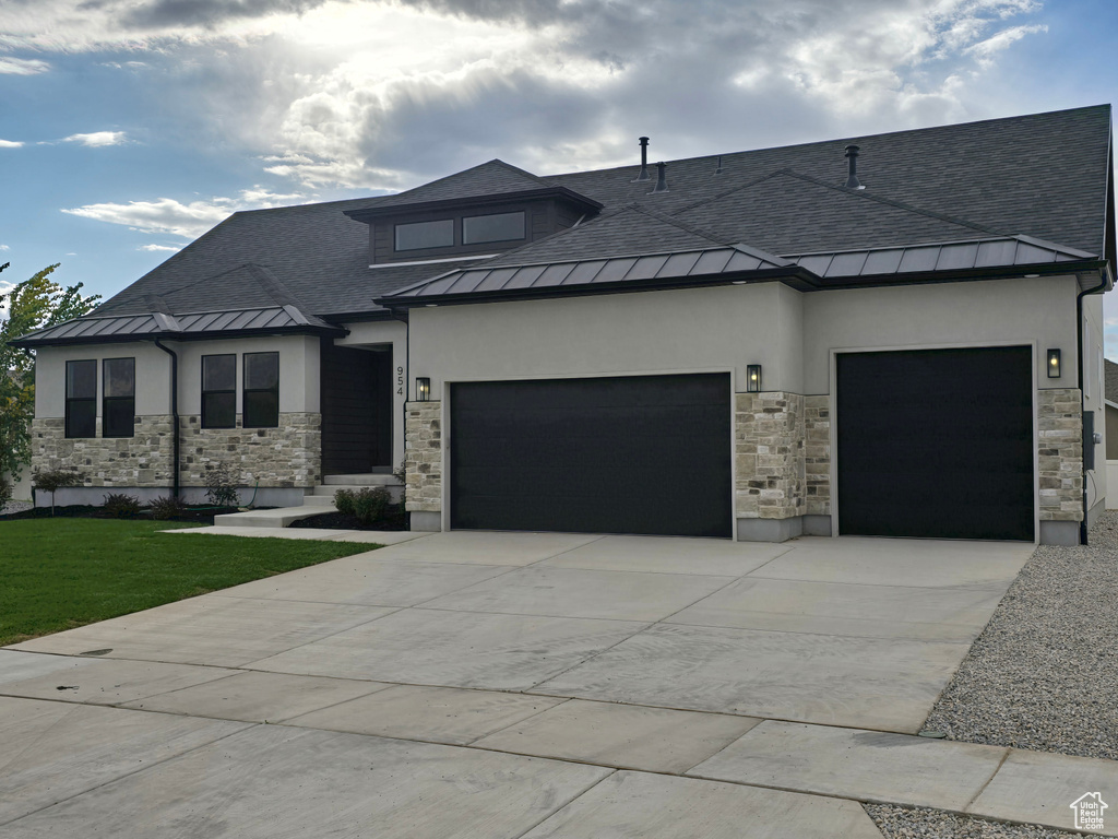 View of front of property featuring a garage