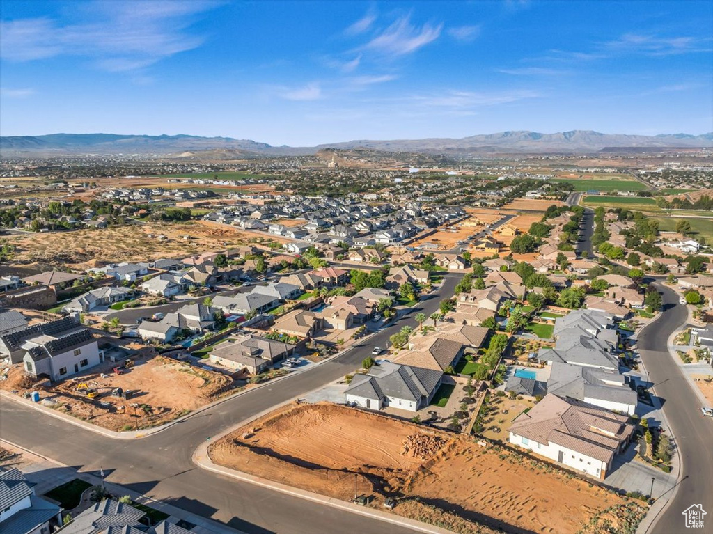 Birds eye view of property with a mountain view