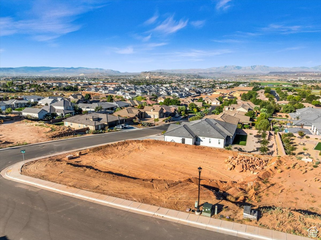 Birds eye view of property with a mountain view