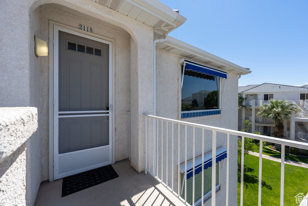 Entrance to property with a balcony