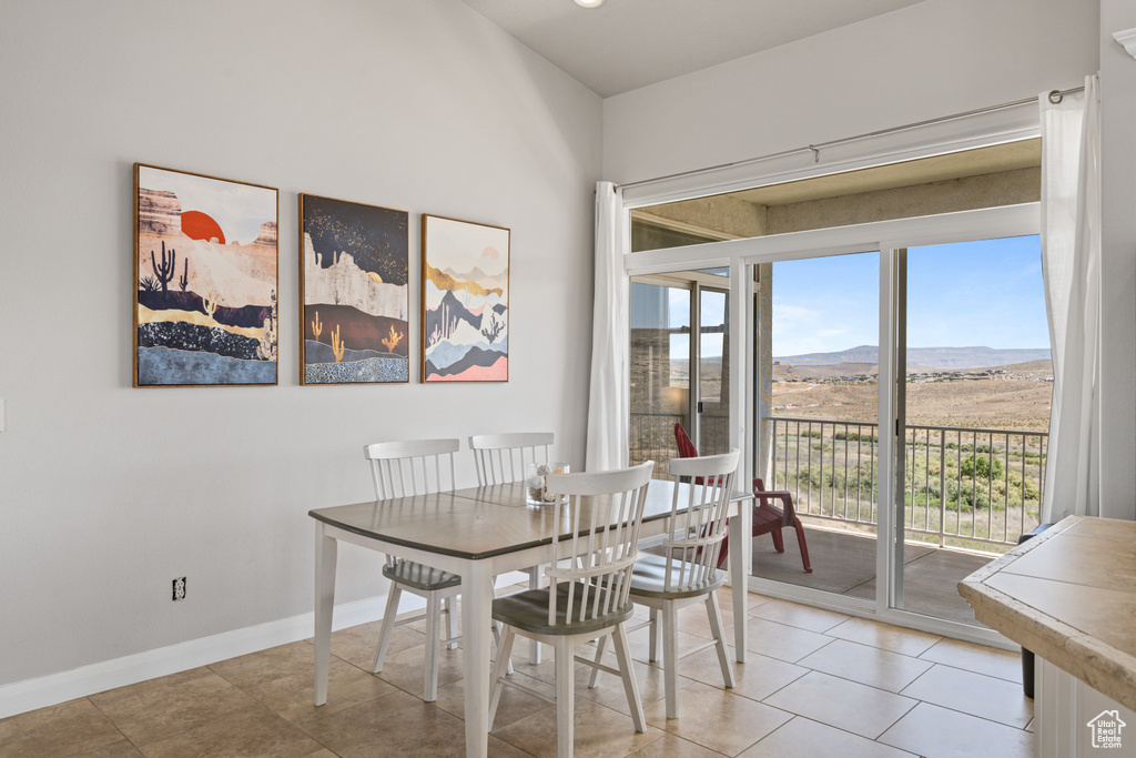 Dining area featuring plenty of natural light and light tile floors