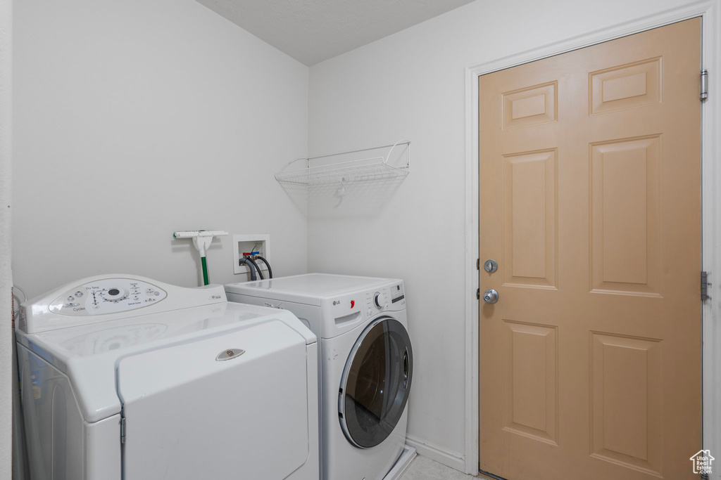 Clothes washing area with washer and clothes dryer and hookup for a washing machine