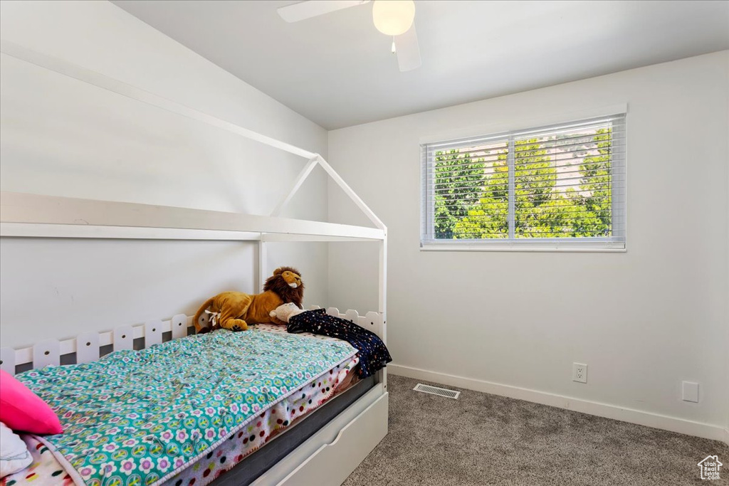 Bedroom with carpet floors and ceiling fan