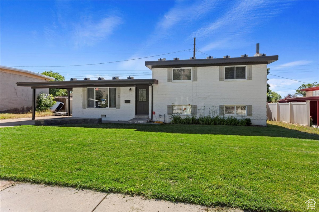 View of front of house featuring a front lawn