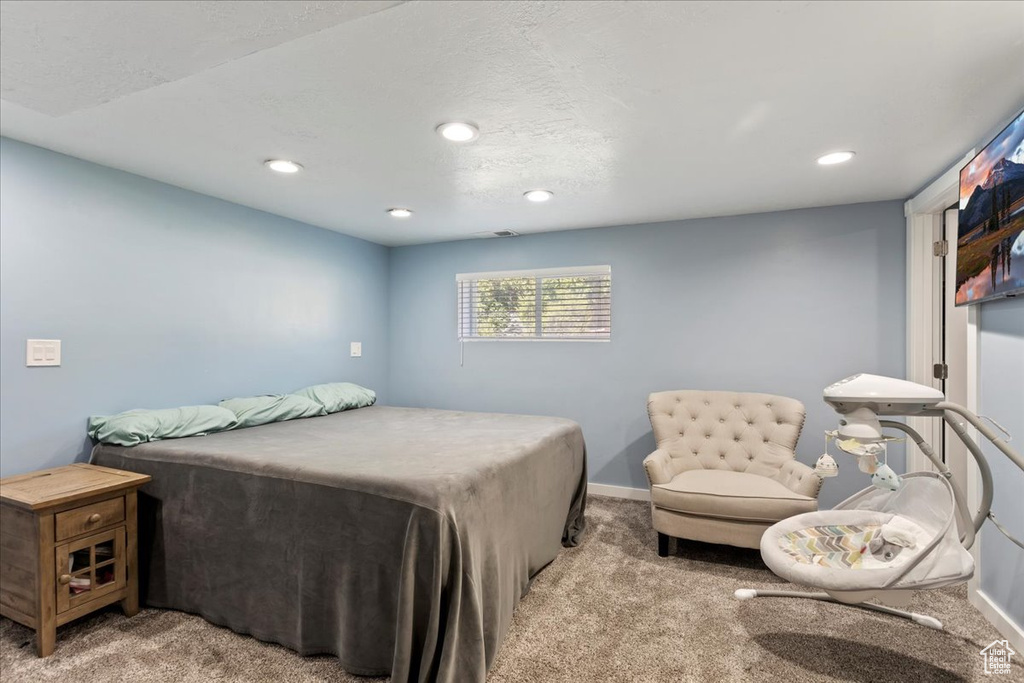 Bedroom featuring carpet floors