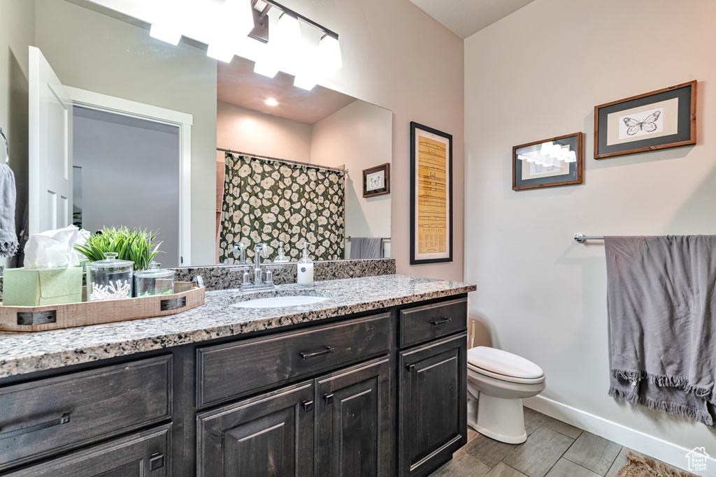 Bathroom with toilet and large vanity