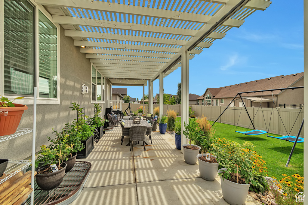 View of patio with a pergola and an outdoor hangout area