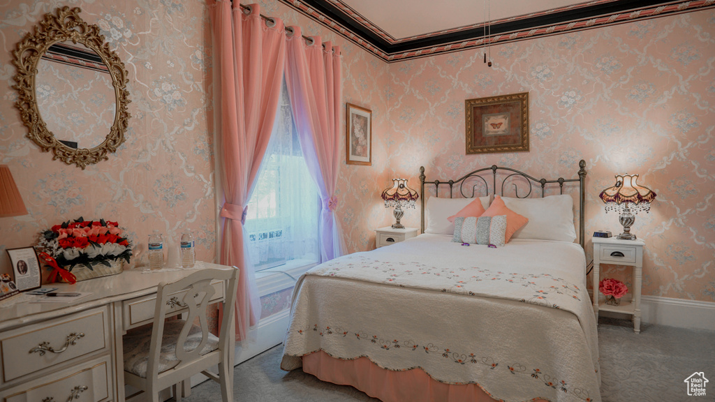 Bedroom featuring carpet and ornamental molding