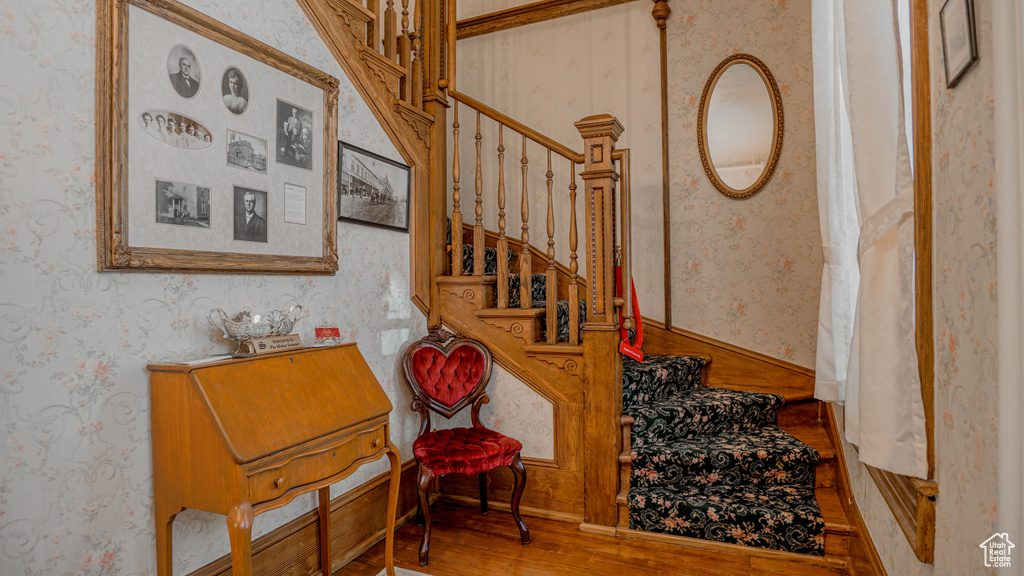 Stairway with hardwood / wood-style floors