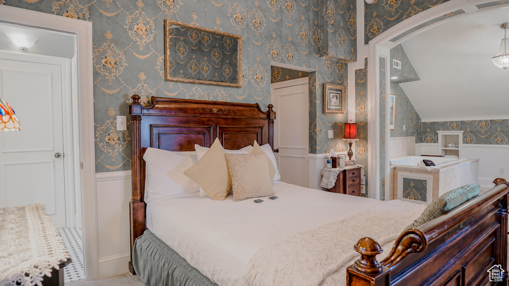 Bedroom featuring vaulted ceiling