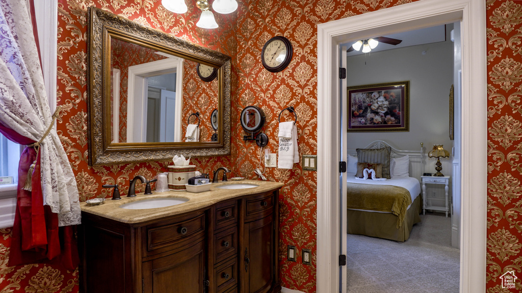 Bathroom with double vanity and ceiling fan