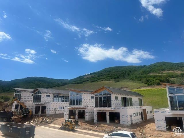 Rear view of property featuring a mountain view