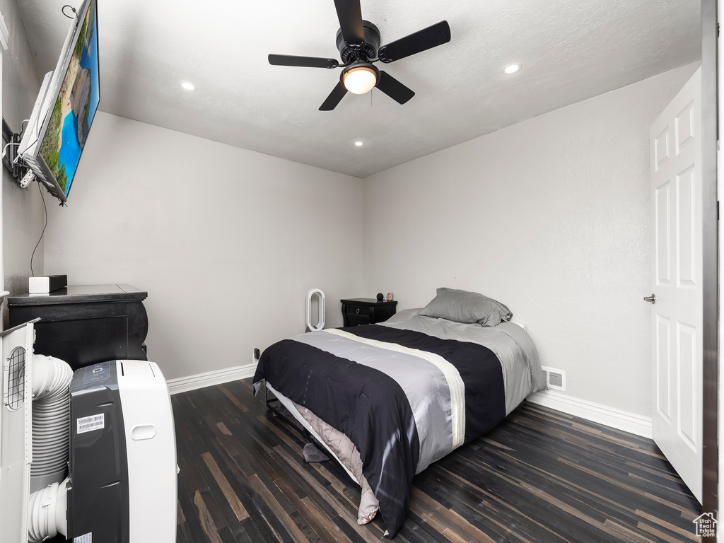 Bedroom featuring hardwood / wood-style floors and ceiling fan