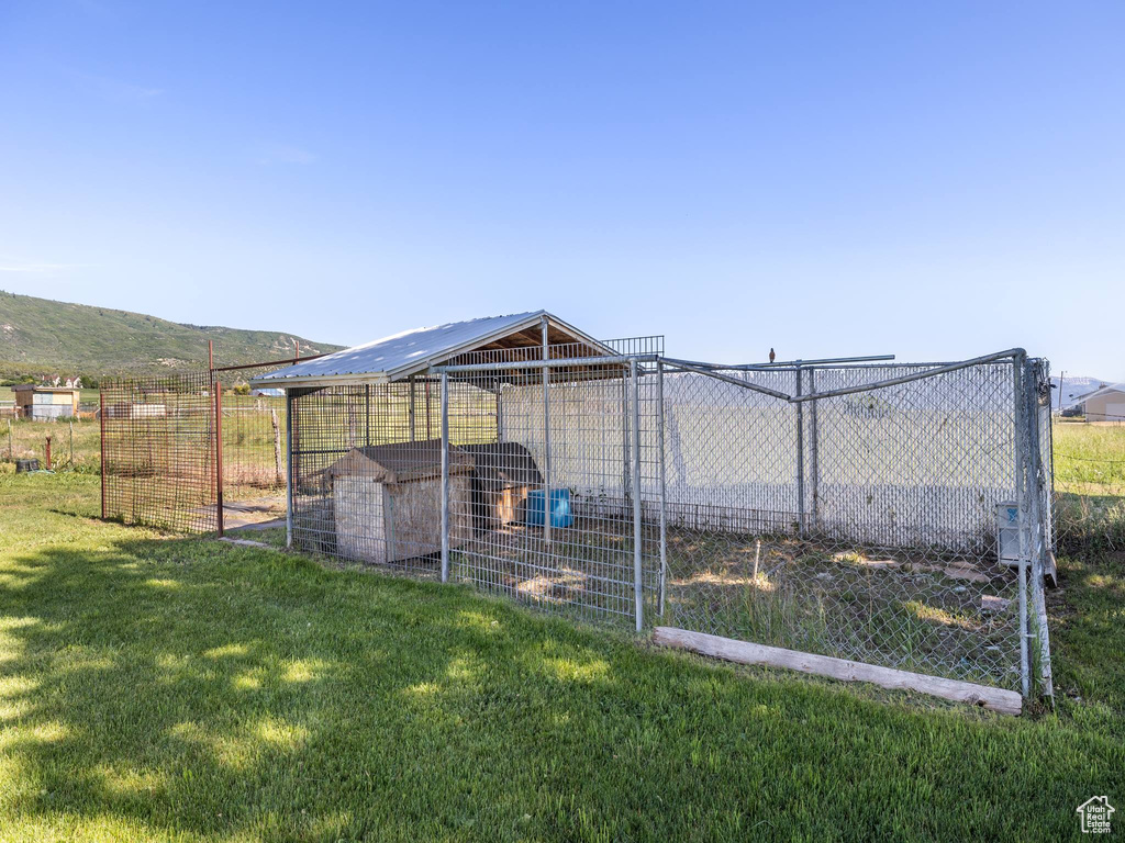 View of yard with a mountain view and an outdoor structure