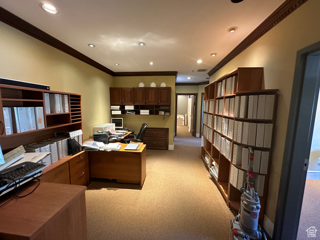 Carpeted office featuring ornamental molding