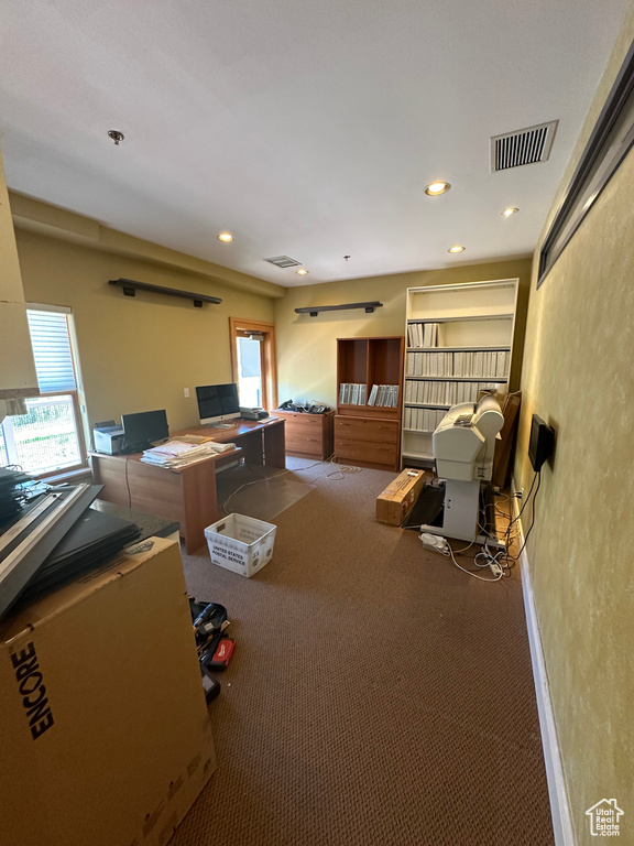 Interior space with carpet and plenty of natural light