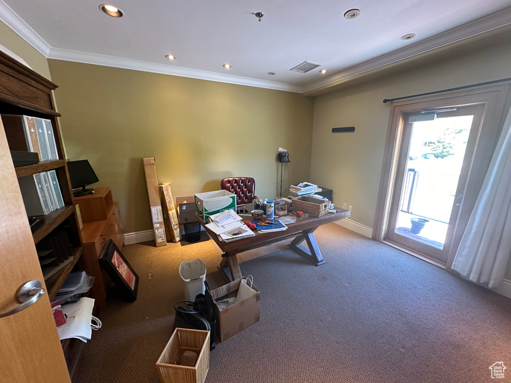 Office area featuring carpet and crown molding