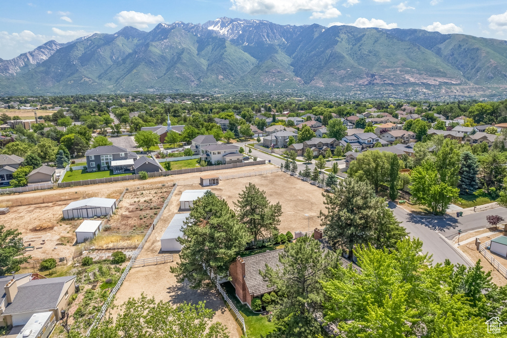 Birds eye view of property with a mountain view