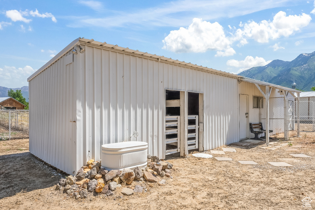 View of outbuilding with a mountain view